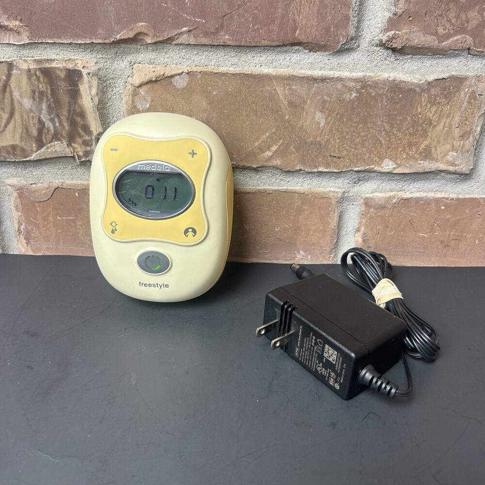 Medela Freestyle Double Electric Breast Pump Motor and Charging Cable.